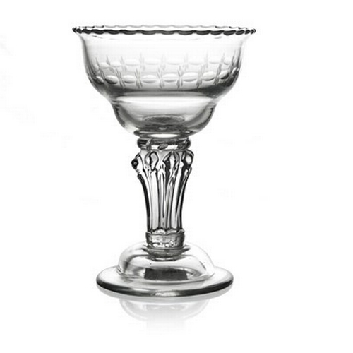 653 - A composite stem pedestal sweetmeat glass, circa 1760, the double ogee bowl engraved with OXO band a... 