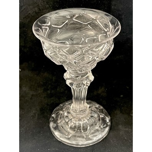 660 - A diamond moulded sweetmeat glass, circa 1740, the double ogee bowl with optic diaper lattice, on a ... 