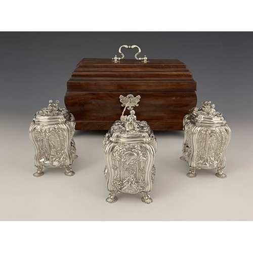 68 - A suite of George II Rococo silver tea caddies and sugar box, each of bombe form with four cast and ... 