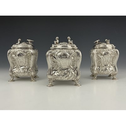 68 - A suite of George II Rococo silver tea caddies and sugar box, each of bombe form with four cast and ... 