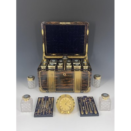 69 - A Victorian fitted dressing case, of rounded rectangular form in brass bound coromandel, with recess... 