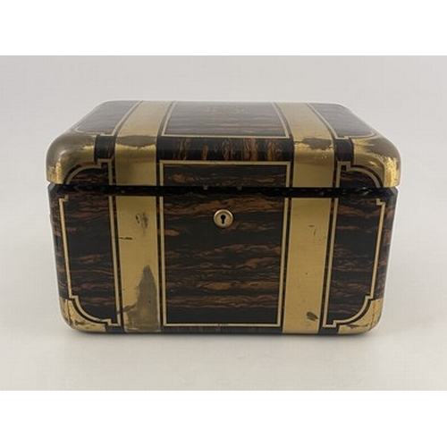 69 - A Victorian fitted dressing case, of rounded rectangular form in brass bound coromandel, with recess... 