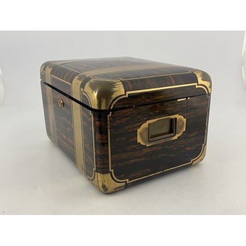 69 - A Victorian fitted dressing case, of rounded rectangular form in brass bound coromandel, with recess... 