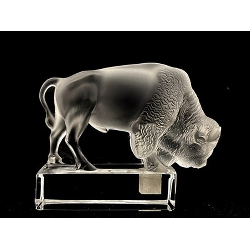 780 - Lalique, a Bison glass paperweight, model 1196, designed circa 1931, polished and frosted, incised m... 