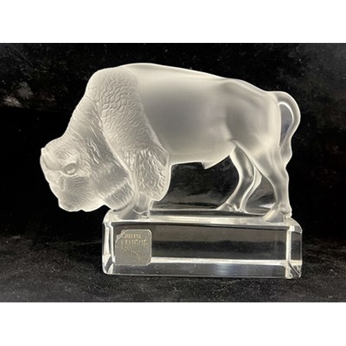 780 - Lalique, a Bison glass paperweight, model 1196, designed circa 1931, polished and frosted, incised m... 