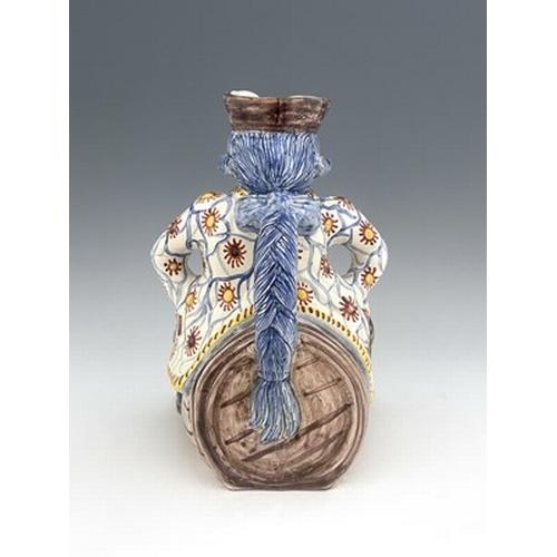 788 - A Dutch Delft toby jug, probably Adrien Kocks, polychrome decorated faience, modelled as a man astri... 