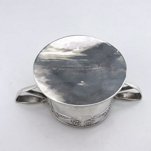 79 - Kate Harris for Goldsmiths and Silversmiths Company, an Arts and Crafts silver twin handled dish, Lo... 