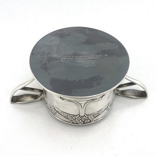 79 - Kate Harris for Goldsmiths and Silversmiths Company, an Arts and Crafts silver twin handled dish, Lo... 