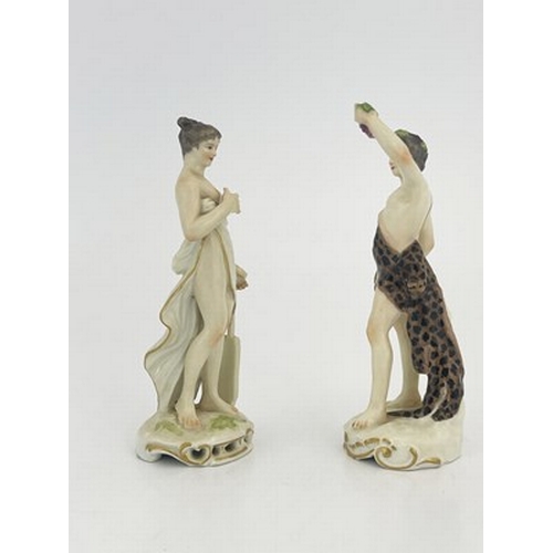 795 - A pair of 19th century German porcelain figures, Meissen sword marks, modelled as Bacchus and a muse... 