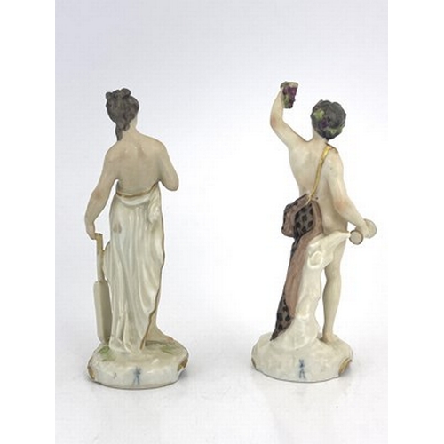 795 - A pair of 19th century German porcelain figures, Meissen sword marks, modelled as Bacchus and a muse... 