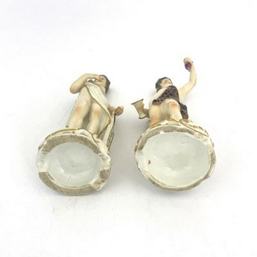 795 - A pair of 19th century German porcelain figures, Meissen sword marks, modelled as Bacchus and a muse... 