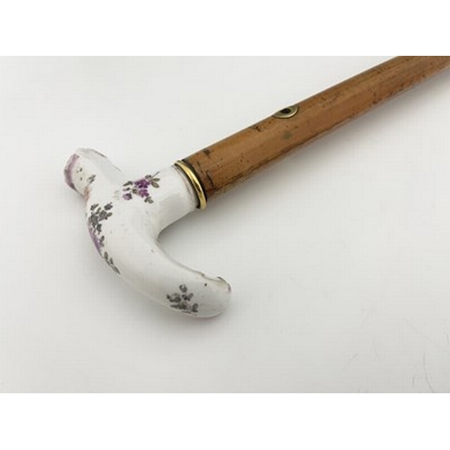 808 - A Meissen porcelain handled and Swedish 18 carat gold mounted malacca cane, the collar dated 1891, t... 