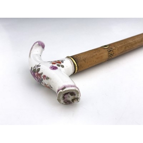 808 - A Meissen porcelain handled and Swedish 18 carat gold mounted malacca cane, the collar dated 1891, t... 