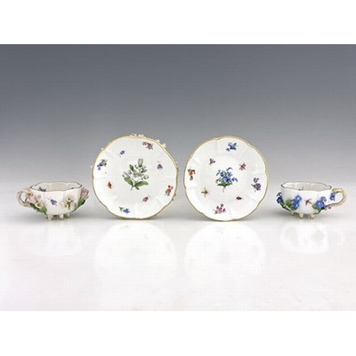 811 - Two Meissen florally encrusted tea cups and saucers, one with forget me nots, the other with campanu... 