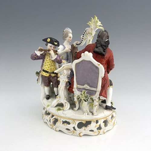 814 - A Meissen figure group, model D48, three musicians, including harpist, on a reticulated Rococo scrol... 