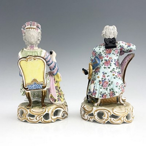 817 - A pair of Meissen type figures, probably late 18th century, model 137, modelled as a seated woman wi... 