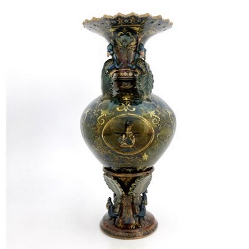 821 - Bombay School of Arts, an Arts and Crafts vase and stand, circa 1880, the amphora form vessel with r... 