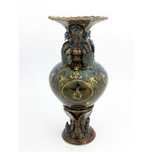 821 - Bombay School of Arts, an Arts and Crafts vase and stand, circa 1880, the amphora form vessel with r... 