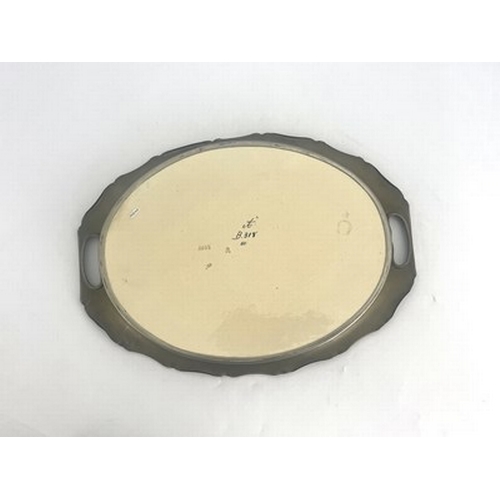 826 - Carl Luber for Johann von Schwarz, an Art Nouveau dust pressed oval tray, decorated with a maiden an... 