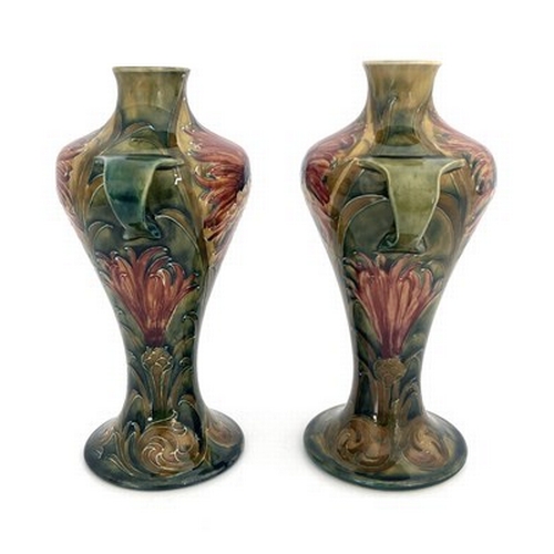 833 - William Moorcroft for Townsend and Co, Newcastle, a pair of twin handled Revived Cornflower vases, 1... 