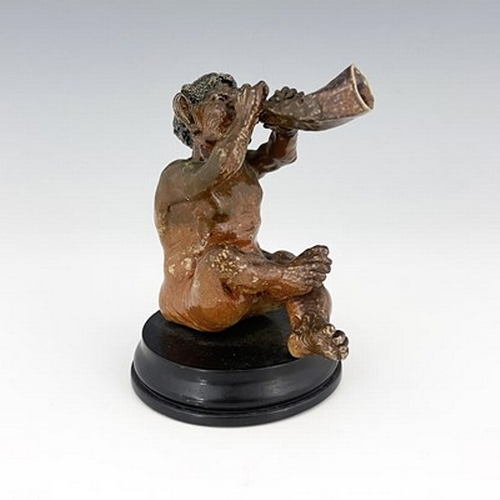 853 - Robert Wallace Martin for Martin Brothers, a stoneware musical imp figure, 1892, modelled playing a ... 