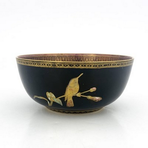 864 - A Wedgwood lustre hummingbird bowl, Imperial form, black ground exterior and purple interior with gi... 