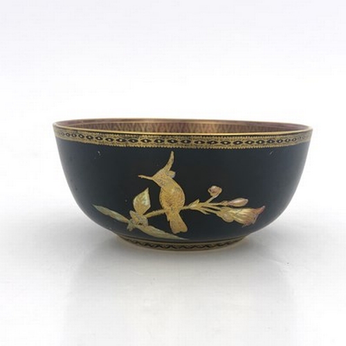 864 - A Wedgwood lustre hummingbird bowl, Imperial form, black ground exterior and purple interior with gi... 