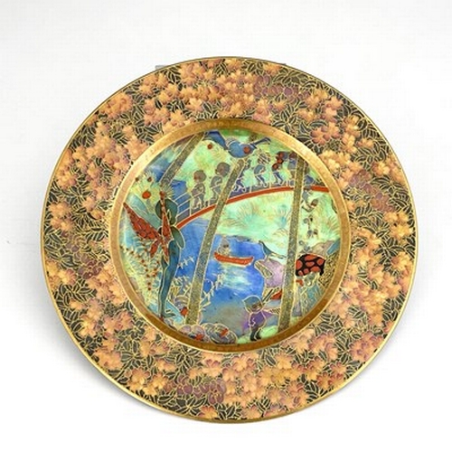 879 - Daisy Makeig-Jones for Wedgwood, a Fairyland lustre plate, Imps on a Bridge and Tree House, with ver... 