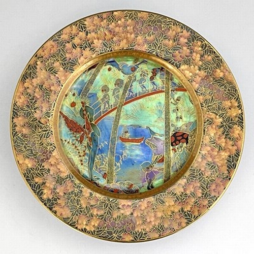 879 - Daisy Makeig-Jones for Wedgwood, a Fairyland lustre plate, Imps on a Bridge and Tree House, with ver... 