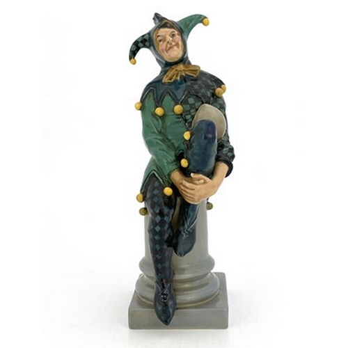 886 - Charles Noke for Royal Doulton, The Jester, figure HN 71, number 18, modelled on a column, green and... 