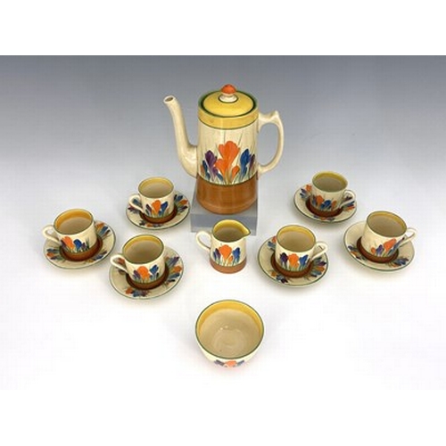 887 - Clarice Cliff for Wilkinson and Newport Pottery, a Crocus pattern coffee set, including coffee pot, ... 