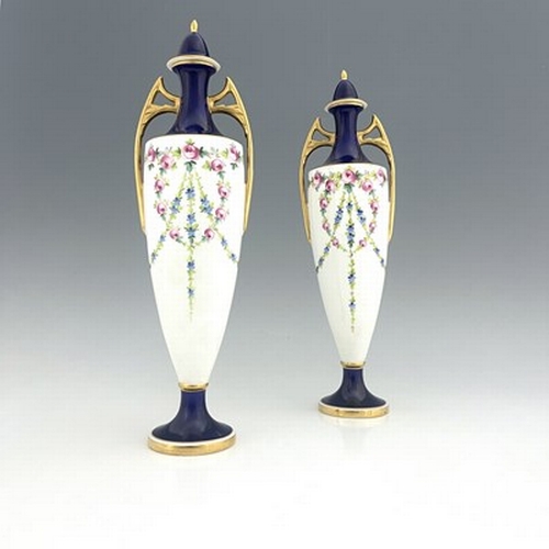 898 - A pair of Minton vases and covers, pedestal twin handled urn form, painted with garlands of roses, p... 