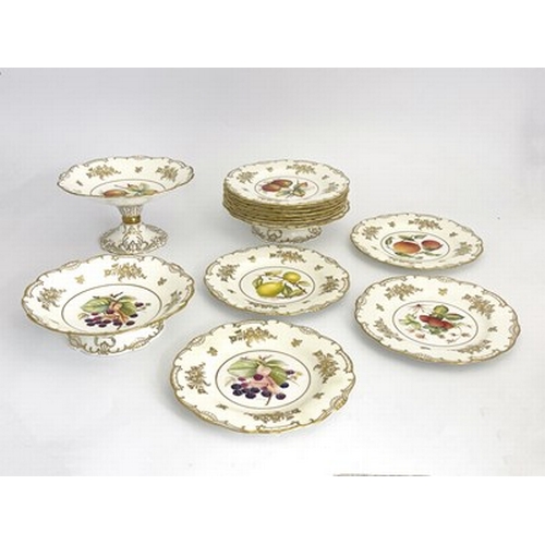 899 - A Minton fruit painted dessert service, various artists, including twelve plates, two comports and a... 