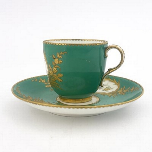 900 - A Minton floral painted and raised paste gilt coffee cup and saucer, circa 1850, in the Sevres style... 