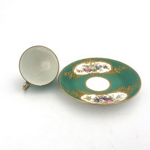 900 - A Minton floral painted and raised paste gilt coffee cup and saucer, circa 1850, in the Sevres style... 