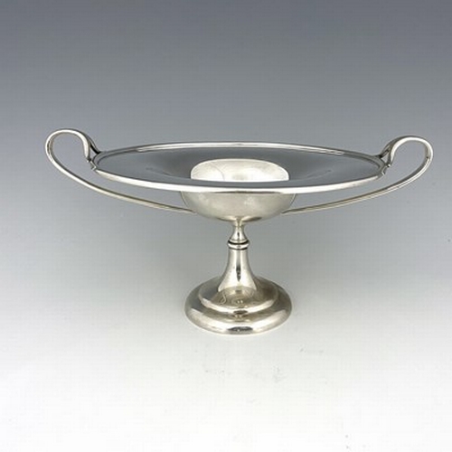 91 - A Scottish Arts and Crafts silver comport, Brook and Son, Edinburgh 1908, the shallow ogee bowl with... 