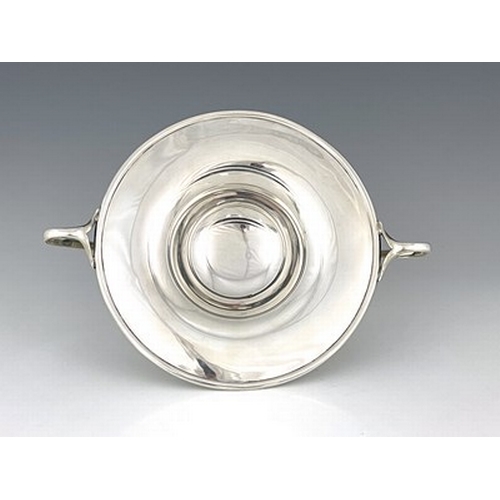 91 - A Scottish Arts and Crafts silver comport, Brook and Son, Edinburgh 1908, the shallow ogee bowl with... 