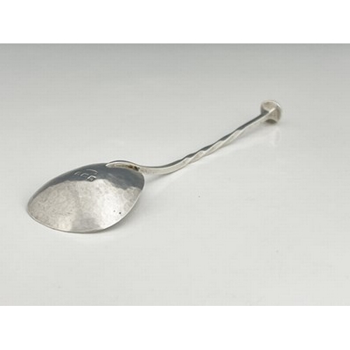 92 - A E Jones, an Arts and Crafts silver spoon, Birmingham 1907, triangular planished bowl on a square s... 