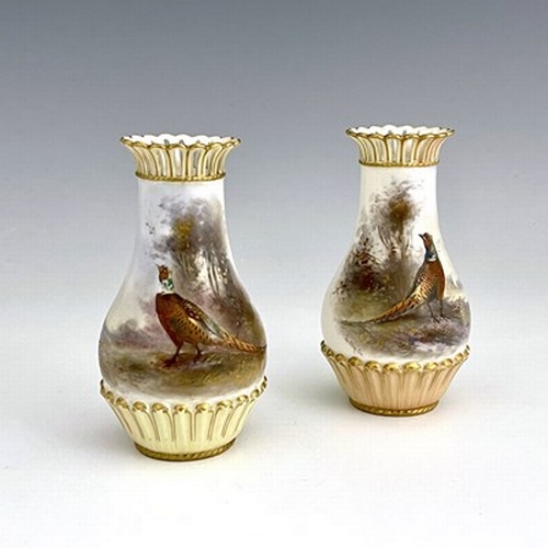 922 - James Stinton for Royal Worcester, a pair of pheasant painted vases, 1904, baluster form, relief mou... 