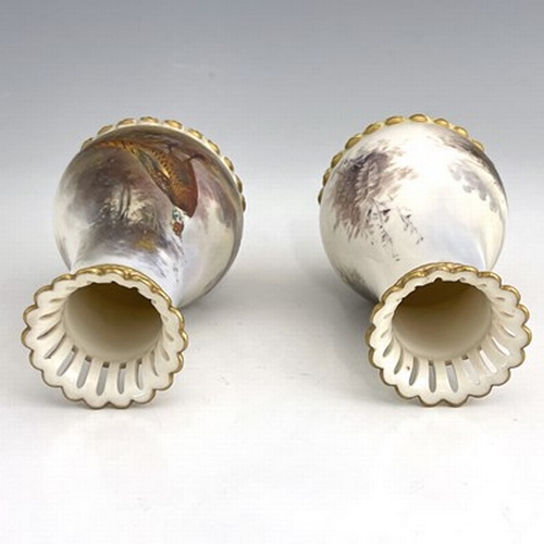 922 - James Stinton for Royal Worcester, a pair of pheasant painted vases, 1904, baluster form, relief mou... 