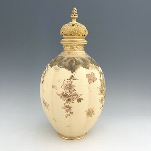 930 - A large Royal Crown Derby blush ivory vase and cover, 1895, lobed ovoid form, painted with dog roses... 