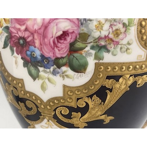 939 - Cuthbert Gresley for Royal Crown Derby, a pair of floral painted twin handled vases and covers, 1907... 