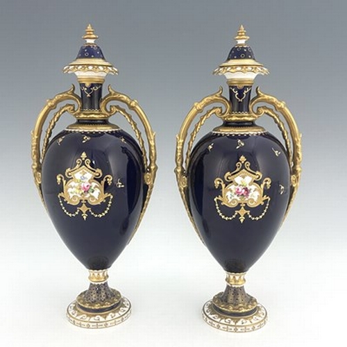 939 - Cuthbert Gresley for Royal Crown Derby, a pair of floral painted twin handled vases and covers, 1907... 