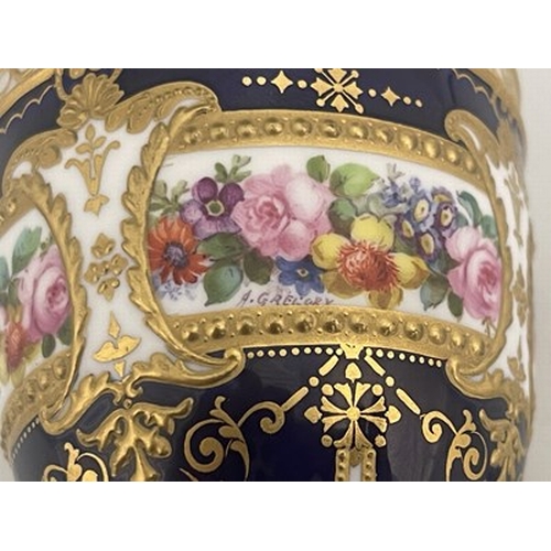 942 - Albert Gregory for Royal Crown Derby, a pair of floral painted ewers, shouldered urn form, decorated... 