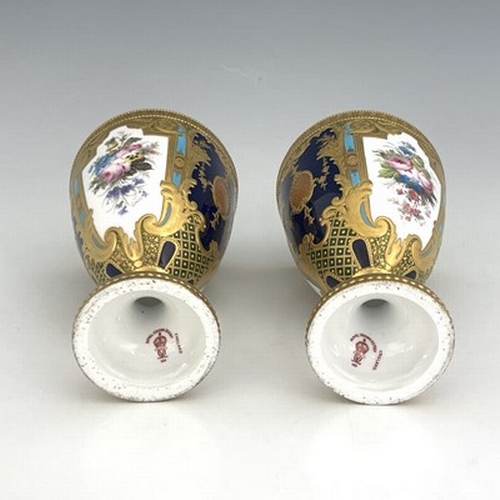 949 - Desire Leroy for Royal Crown Derby, a pair of floral painted vases, 1901, shouldered pedestal urn fo... 