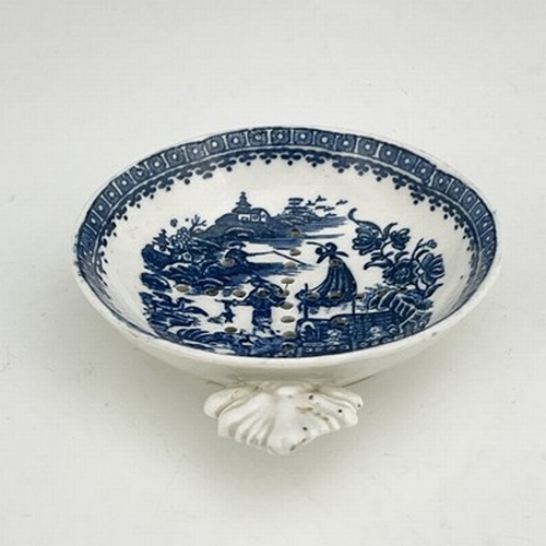 954 - A Caughley blue and white egg strainer, circa 1780, transfer printed cormorant pattern, leaf moulded... 