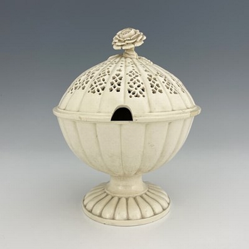 957 - A Creamware comport, with reticulated cover and flower finial, Leeds, circa 1780, 22.5cm high