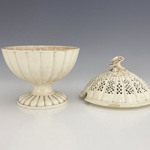 957 - A Creamware comport, with reticulated cover and flower finial, Leeds, circa 1780, 22.5cm high