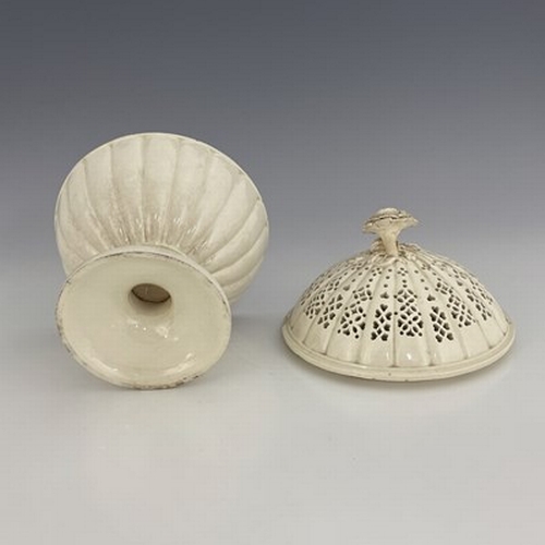 957 - A Creamware comport, with reticulated cover and flower finial, Leeds, circa 1780, 22.5cm high