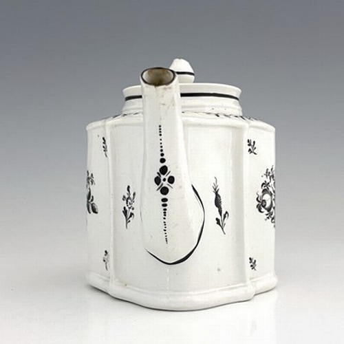 958 - A New Hall porcelain teapot, circa 1780, pattern 133, of small proportions, silver shape, 20cm long